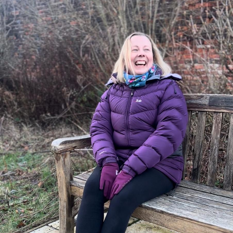 Rebecca from Pilates and Wellness by Rebecca Anne sitting on a bench in Sheffield.